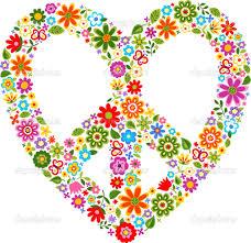 This is an image of a heart with a peace sign in the center, all made of colorful flowers.